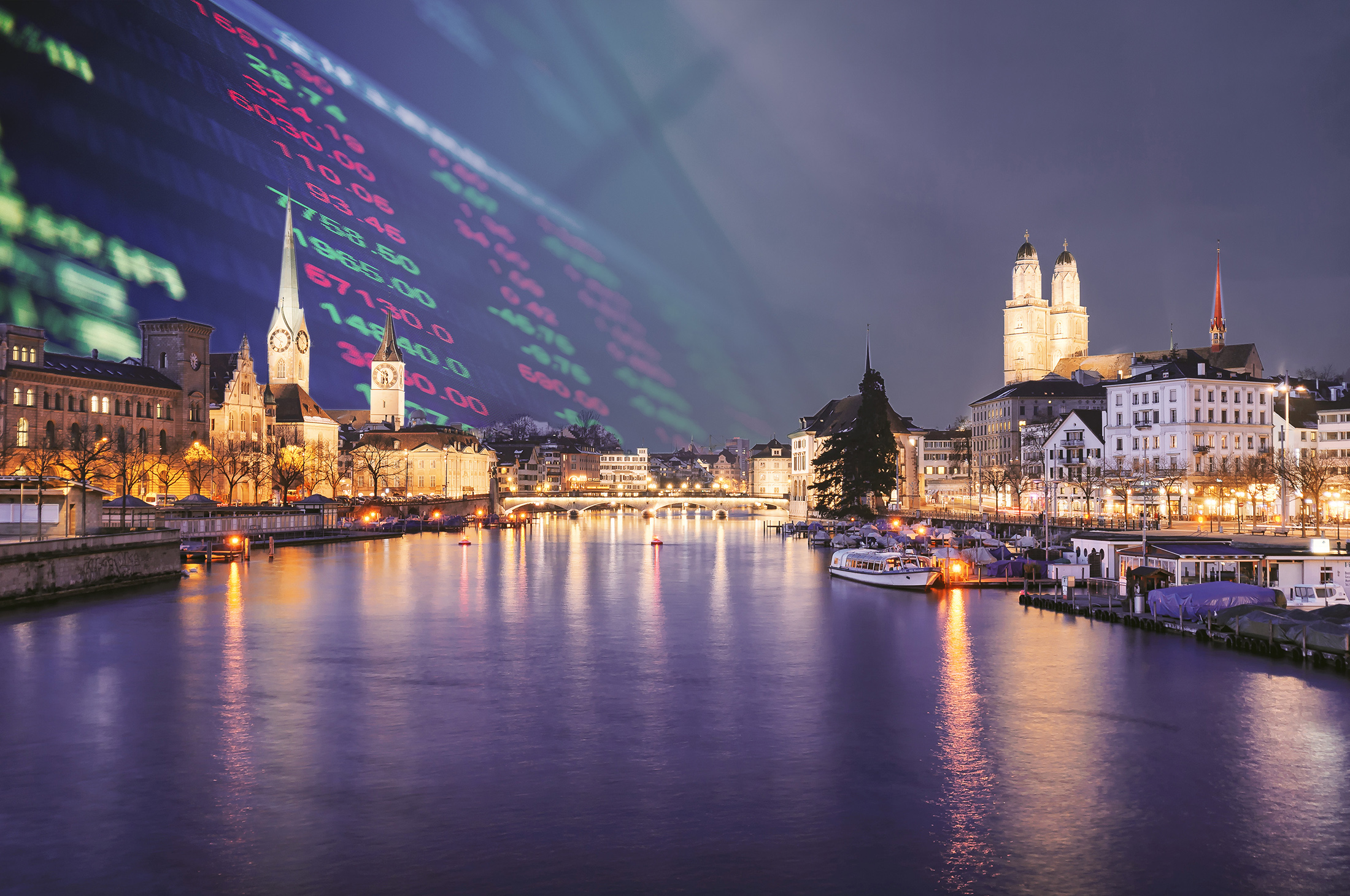 Zurich city center viewed from the river by night - PMW Asset Management